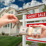 Handing Over Cash For House Keys And Short Sale Sign