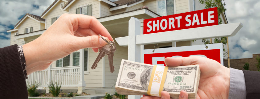 Handing Over Cash For House Keys And Short Sale Sign